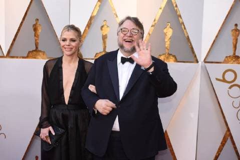 March 4, 2018 - Los Angeles, California, U.S. - GUILLERMO DEL TORO, right, who arrives with Screenwriter KIM MORGAN on the red carpet for the 90th Annual Academy Awards at the Dolby Theatre. Del Toro, won a Best Director Oscar for The Shape of Water. Los Angeles U.S. - ZUMAz03_ 20180304_zbp_z03_155 Copyright: xKevinxSullivanx