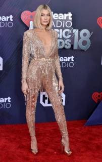 Model Hailey Baldwin arrives for the iHeartRadio Music Awards at The Forum in Inglewood, California on March 11, 2018. Turner s TBS, TNT, and truTV channels broadcasted the ceremony live from The Forum.  LAP20180311186 JIMxRUYMEN