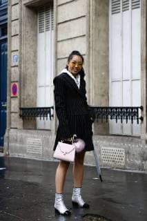 Blogger Yuyu posing outside of the Akris runway show during Paris Fashion Week - Oct 1, 2017 - PFW: Spring 2018 Street Style Day 6, Paris France  Copyright: xValentinaxRanierix h_00451773