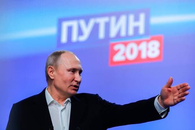 MOSCOW, RUSSIA - MARCH 18, 2018: Russia s current president Vladimir Putin, a candidate in the 2018 Russian presidential election, meets with his campaign representatives at his election campaign headquarters on the day of the 2018 Russian presidential election. Mikhail Metzel TASS  TS078780
