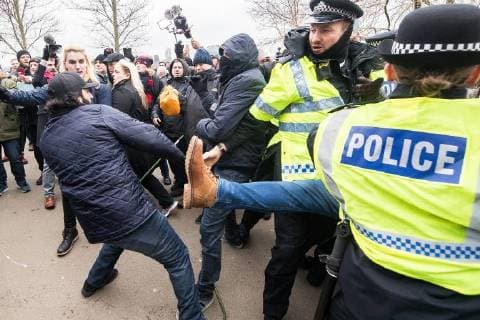 March 18, 2018 - London, London, UK - London , UK . Police intervene as supporters and those opposed to the speech fight at Speakers Corner . Alt-right groups , including Generation Identity and the Football Lads Alliance , at Speakers Corner in Hyde Park ahead of Tommy Robinson reading a speech by Generation Identity campaigner Martin Sellner . Along with Brittany Pettibone , Sellner was due to deliver the speech last week but the pair were arrested and detained by police when they arrived in the UK , forcing them to cancel an appearance at a UKIP Young Independence youth event , which in turn was reportedly cancelled amid security concerns London UK  - ZUMAl94_ 20180318_zaf_l94_080 Copyright: xJoelxGoodmanx