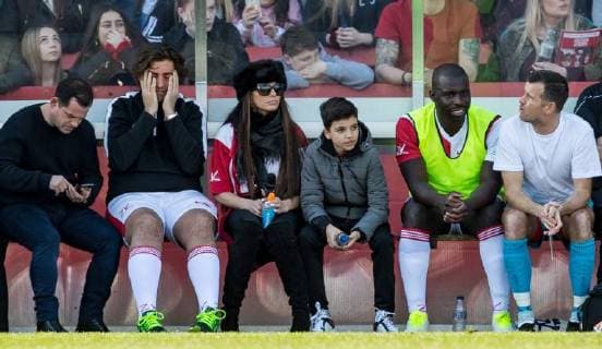 Katie Price sits beside James Arg Argent during the Sellebrity Soccer Benjamin Lewis Charity Cup Celebrity Football Match for Midland Air Ambulance & British Heart Foundation at the LCI Rail Stadium, Cheltenham, England on 25 March 2018. Copyright: xAndyxRowlandx PMI-1919