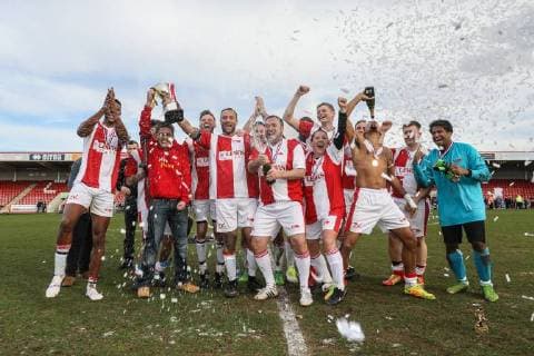 The winning team, Midland Air Ambulance, celebrate their victory after the Celebrity Charity Football Match hosted by Sellebrity Soccer for the Benjamin Lewis Charity Cub at the Abbey Business Stadium, Cheltenham, England on 25 March 2018. Copyright: xDavidxHornx PMI-1918