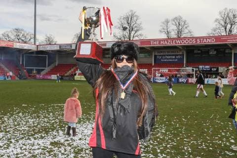 Manager of the winning Midland Air Ambulance team, Katie Price, lifts the trophy after the Celebrity Charity Football Match hosted by Sellebrity Soccer for the Benjamin Lewis Charity Cub at the Abbey Business Stadium, Cheltenham, England on 25 March 2018. Copyright: xDavidxHornx PMI-1918