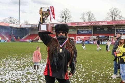 Manager of the winning Midland Air Ambulance team, Katie Price, lifts the trophy after the Celebrity Charity Football Match hosted by Sellebrity Soccer for the Benjamin Lewis Charity Cub at the Abbey Business Stadium, Cheltenham, England on 25 March 2018. Copyright: xDavidxHornx PMI-1918
