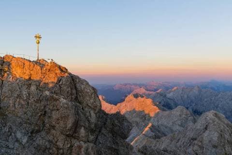 Austria, Germany, Bavaria, Zugspitze, summit cross in the evening light  FOF09850