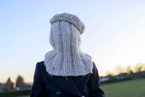 Boy covering his face with knitted round scarf model released Symbolfoto  KMKF00156