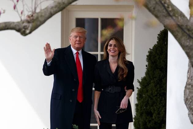 (180329) -- WASHINGTON, March 29, 2018 -- U.S. President Donald Trump (L) poses with outgoing White House Communications Director Hope Hicks on the West Wing Colonnade before departing from the White House in Washington D.C., the United States, on March 29, 2018. ) U.S.-WASHINGTON D.C.-TRUMP-DEPARTURE TingxShen 