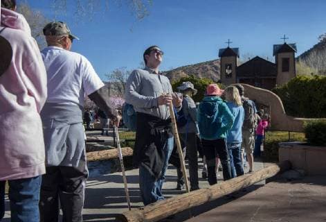 March 30, 2018 - U.S. - Conrad Farnsworth, from Wyoming but working at LANL, waits in line to enter the Santuario de Chimayo. Thousands of people were making their Good Friday pilgrimage to the Northern New Mexico Church, Friday March 30, 2018. U.S. - ZUMAab1_ 20180330_zaf_ab1_007 Copyright: xEddiexMoorex