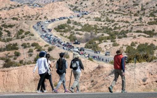 March 30, 2018 - U.S. - People make their way along Juan Medina Road to the Santuario de Chimayo. Thousands of people were making their Good Friday pilgrimage to the Northern New Mexico Church, Friday March 30, 2018. U.S. - ZUMAab1_ 20180330_zaf_ab1_006 Copyright: xEddiexMoorex