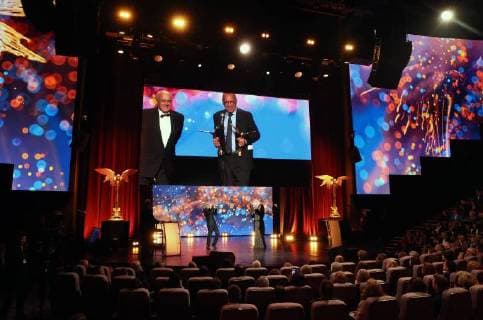 MOSCOW REGION, RUSSIA - APRIL 1, 2018: The video screen shows film directors Vladimir Menshov (L) and Andrei Konchalovsky at the 31st Nika Award Ceremony at the Vegas City Hall concert hall in Krasnogorsk, Moscow Region. Vyacheslav Prokofyev TASS  TS07A305