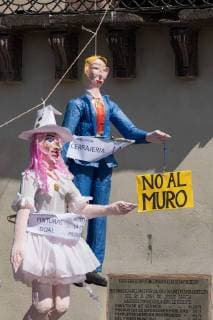 April 1, 2018 - San Miguel De Allende, Guanajuato, Mexico - An effigy of U.S. President Donald Trump hangs in the Plaza Allende with other paper dolls in preparation for the Burning of Judas Easter-time ritual marking the end of Holy Week April 1, 2018 in San Miguel de Allende, Mexico. While the tradition includes burning a paper effigy of Judas a recent popular addition has been paper doll caricatures of Donald Trump across Mexico. The doll is holding a sign saying No Wall in reference to the Trump border wall. San Miguel De Allende Mexico - ZUMAe02_ 20180401_zaf_e02_001 Copyright: xRichardxEllisx