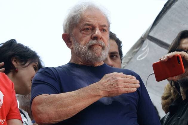 April 7, 2018 - Sao Paulo, Brazil - Former President Luiz Inacio Lula da Silva, with impeached former president Dilma Rousseff, gestures to supporters at the headquarters of the Metalworkers Union where a Catholic mass was held in memory of his late wife Marisa Leticia on April 7, 2018 in the Sao Bernardo do Campo section of Sao Paulo, Brazil. An arrest warrant was issued on Thursday for da Silva to serve a 12-year jail term for corruption. The 72 year old former president told the crowd I will comply with their warrant. Sao Paulo Brazil  - ZUMAn230 20180407_zaa_n230_806 Copyright: xFotoruax