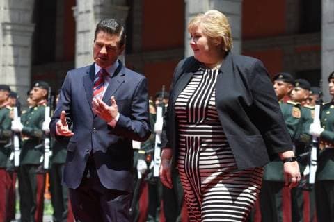April 12, 2018 - Mexico City, Mexico - Mexican President Enrique Pena Nieto (R) and Norwegian prime Minister Erna Solberg, talk during her welcome ceremony at the National Palace in Mexico City on April 12, 2018. Mexico City Mexico  - ZUMAn230 20180412_zaa_n230_842 Copyright: xCarlosxTischlerx