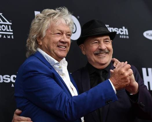 John Lodge (L) and Mike Pinder of Moody Blues pose for a photo on the red carpet at the 33rd annual Rock and Roll Hall of Fame induction ceremonies at Public Hall on April 14, 2018 in Cleveland Ohio. Bon Jovi, the Cars and four first-time nominees, including Nina Simone, will be inducted Saturday night as the 2018 Rock & Roll Hall of Fame class.  CLE201804145019 SCOTTxMCKINNEY