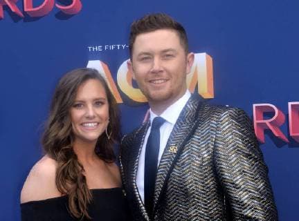 Gabi Dugal (L) and singer Scotty McCreery attend the 53rd annual Academy of Country Music Awards held at MGM Grand Garden Arena in Las Vegas, Nevada on April 15, 2018. The show will be telecast live on CBS.  LAV20180415028 JIMxRUYMEN
