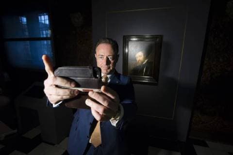 Antwerp Mayor Bart De Wever takes a selfie picture with his smartphone as he stands in front of the painting, at the press presentation of the restoration of a self-portrait of famous Flemish painter Rubens, Monday 16 April 2018, in Antwerp.  KRISTOFxVANxACCOM 05330191