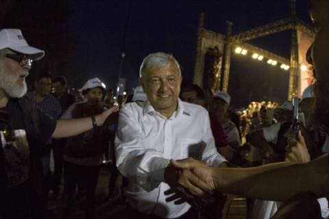 April 20, 2018 - Xochimilco, Mexico, MEXICO - Presidential candidate Andres Manuel Lopez Obrador, with the MORENA party, shakes hands with supporters during his campaign rally in Milpa Alta in Mexico City, Friday, April 20, 2018. Mexico will hold general elections on July 1. Xochimilco MEXICO - ZUMAp124 20180420_zaa_p124_503 Copyright: xOctavioxNavax
