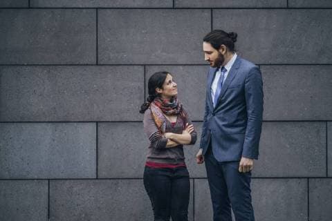 Businessman and woman looking at each other model released Symbolfoto  JSCF00094