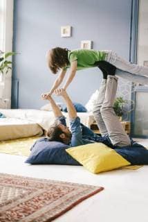Happy father and son playing at home model released Symbolfoto property released  KNSF03625