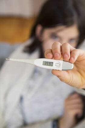 Girl s hand holding clinical thermometer, close-up model released Symbolfoto  LVF06800