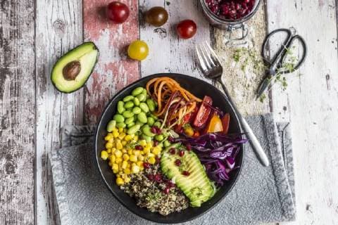 Quinoa veggie bowl of avocado, Edamame, tomatoes, corn, carrots, red cabbage and pomegranate seed  SARF03592