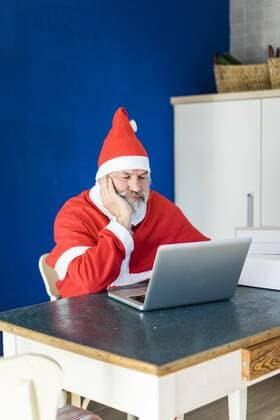 Frustrated Santa using laptop at home model released Symbolfoto property released  MOEF00993