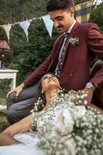 Happy bride smiling and lying with groom in the field model released Symbolfoto property released  DAPF00927