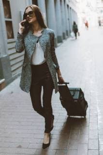 Young tourist on the phone walking down the street model released Symbolfoto  OCAF00166