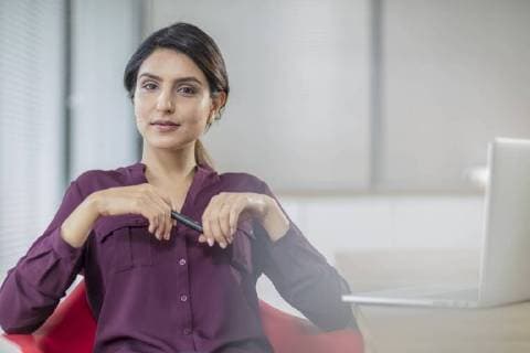 Portrait of confident businesswoman with laptop in office model released Symbolfoto property released  ZEF15038