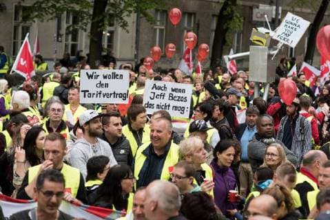 April 24, 2018 - Berlin, Germany - We want the collective agreement! Even though Jeff Bezos dislikes: is written on signs during the demonstration against the awarding of the Axel Springer Award 2018 to Amazon founder Jeff Bezos for his visionary entrepreneurship . Employees of the company demonstrated under the motto Make Amazon Pay Again against the Axel Springer Award the outstanding personalities, according to the media company, who are particularly innovative, create and change markets and face up to their social responsibility. Trade unions criticize the poor working conditions in Amazon s logistics centers, which they do not consider worthy of praise. Berlin Germany - ZUMAs197 20180424_zaa_s197_011 Copyright: xMarkusxHeinex