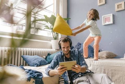 Father and son having a pillow fight at home model released Symbolfoto property released  KNSF03616
