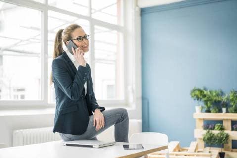 Businesswoman working from home, talking on the phone model released Symbolfoto property released  MOEF00919