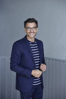 Portrait of smiling businessman with stubble wearing blue suit and glasses model released Symbolfoto  PNEF00540