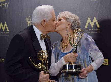 Bill Hayes (L) and Susan Seaforth Hayes hold their Lifetime Achievement Awards as they kiss backstage in the press room during the 45th Annual Daytime Emmy Awards at the Pasadena Civic Auditorium in Pasadena, California on April 29, 2018.  LAP201804291055 CHRISxCHEW
