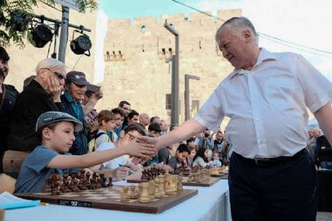 April 30, 2018 - Jerusalem, Israel - ANATOLY YEVGENYEVICH KARPOV (R), 66, Russian chess grandmaster, plays chess against dozens of Israeli youth champions simultaneously at the Jaffa Gate in the framework of Israel s 70th Independence Day celebrations. Jerusalem Israel - ZUMAa126 20180430_zap_a126_511 Copyright: xNirxAlonx