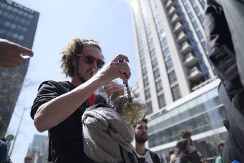 May 5, 2018 - Toronto, Canada - during the Toronto Global Marijuana march 2018, just a few months before Participants smoking Global Marijuana from their bong Canada legalizes Marijuana in Toronto, Canada, on May 5, 2018. Toronto Canada  - ZUMAn230 20180505_zaa_n230_1299 Copyright: xArindamxShivaanix
