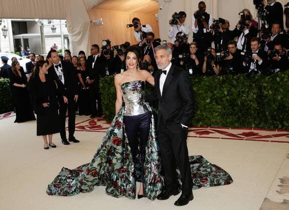 Amal Clooney and George Clooney arrive on the red carpet at The Metropolitan Museum of Art s Costume Institute Benefit Heavenly Bodies: Fashion and the Catholic Imagination at Metropolitan Museum of Art in New York City on May 7, 2018.  NYP20180507208 JOHNxANGELILLO