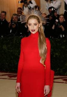Amber Heard arrives on the red carpet at The Metropolitan Museum of Art s Costume Institute Benefit Heavenly Bodies: Fashion and the Catholic Imagination at Metropolitan Museum of Art in New York City on May 7, 2018.  NYP20180507362 JOHNxANGELILLO
