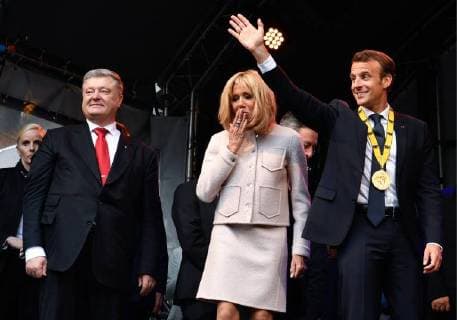 AACHEN, GERMANY - MAY 10, 2018: Ukraine s President Petro Poroshenko (L) and France s President Emmanuel Macron (R) with wife Brigitte Macron (C) during a meeting. Mykola Lazarenko Press Office of the President of Ukraine TASS  TS07F03A