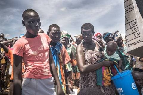 May 7, 2018 - Bidi Bidi, Uganda - South Sudanese refugees seen start to lose their patients as they had been waiting for hours and still unable to collect their food supply..The Bidi Bidi refugee settlement in northern Uganda near the South Sudanese border is currently the largest refugee camp in the world, hosting over 250,000 South Sudanese refugees fleeing the conflict. The world food program is providing monthly basic food supply for the refugees in the settlement. Bidi Bidi Uganda - ZUMAs197 20180507_zab_s197_002 Copyright: xGeovienxSox