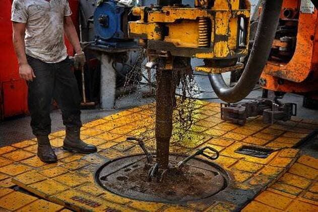 August 27, 2013 - Watford City, North Dakota, USA - United States - The drilling rig floor is slick with grease and oil. (JIM GEHRZ STAR TRIBUNE) December 17, 2013, Watford City, ND Ã¢â‚¬ BACKGROUND INFORMATION- PHOTOS FOR USE IN FINAL PART OF NORTH DAKOTA OIL BOOM PROJECT: Men work around the clock at Raven Rig No. 1 near Watford City, one of nearly 200 towering oil rigs in the Bakken. Once the rigs drill holes, several miles deep and then several miles horizontally, hydraulic fracturing technology (Ã¢â‚¬oefrackingÃ¢â‚¬Â) is then employed to extract oil and natural gas from the underlying shale formation. Watford City USA - United States - ZUMAm42_ 20130827_zaf_m42_030 Copyright: xJimxGehrzx