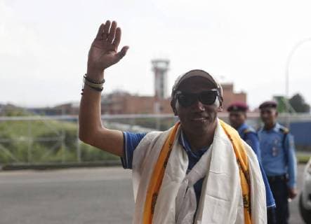 (180520) -- KATHMANDU, May 20, 2018 -- Kami Rita Sherpa arrives at Tribhuvan International Airport in Kathmandu, Nepal, on May 20, 2018. Nepal s Kami Rita Sherpa on Wednesday scaled the world s highest peak Qomolangma for the 22nd time with a record of highest number of summits, government officials confirmed. ) (hy) NEPAL-KATHMANDU-KAMI RITA SHERPA-QOMOLANGMA sulavxshrestha 