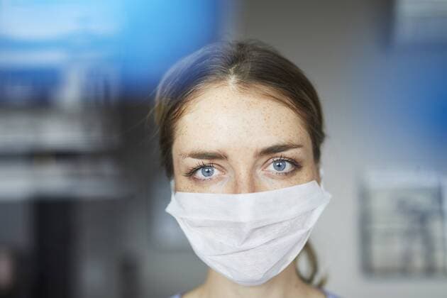 Portrait of woman wearing surgical mask model released Symbolfoto  PNEF00594