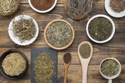Various herbal infusions on wood, chamimile, mint, rooibos, thyme, green tea, tisane  SKCF00377