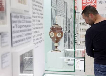 MOSCOW, RUSSIA - JUNE 1, 2018: A man views an exhibition on the 1897-2018 history of Russian football at the VDNKh exhibition centre. The exhibition covers the history of Russian and Soviet football from the first football team in the Russian Empire (1897) up to the present times. Alexander Shcherbak TASS  TS08233B