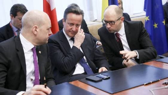 - BRUSSELS, BELGIUM: Sweden Prime Minister Frederik Reinfeldt, British Prime Minister David Cameron and Ukrainian Prime Minister Arseniy Yatsenyuk pictured at the signature of an agreement with Ukraine on the second day of the EU summit of heads of state and government, at the EU headquarters in Brussels, Friday 21 March 2014. POOLxOLIVIERxHOSLET  x56305712x