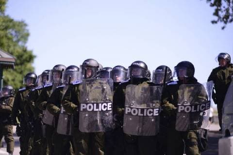 June 9, 2018 - Quebec City, Ontario, Canada - Riot Police officers keeping an on the people during a rally to protest the G7 summit in Quebec City, Canada on 9 June 2018. During the last day of the G7 summit that is happening in La Malbaie, Quebec, protesters came on to the streets to protest the summit in Quebec City. Quebec City Canada  - ZUMAn230 20180609_zaa_n230_1049 Copyright: xArindamxShivaanix