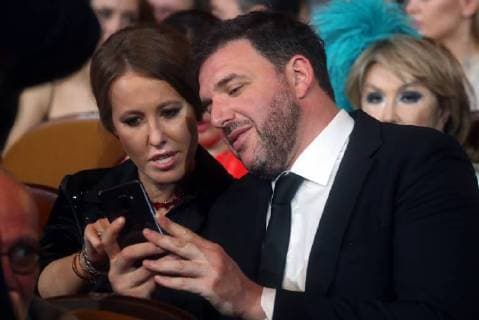 SOCHI, RUSSIA - JUNE 10, 2018: Journalist and L Officiel Russia editor-in-chief Ksenia Sobchak (L) and her husband, actor Maxim Vitorgan at the closing ceremony of the 29th Kinotavr Film Festival. Vyacheslav Prokofyev TASS  TS0836C6