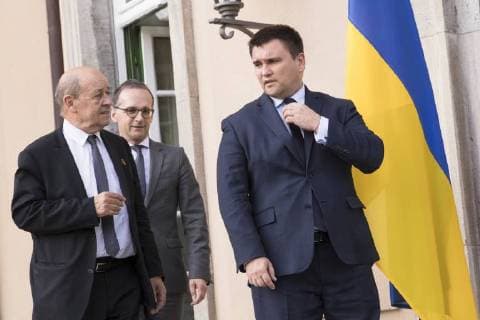 June 11, 2018 - Berlin, Germany - (R-L) Ukrainian Foreign Minister Pavlo Klimkin, German Foreign Minister Heiko Maas and French Foreign Minister Jean-Yves Le Drian arrive to pose for a family photo before a meeting in Normandy format for talks on the situation in Ukraine at Villa Borsig in Berlin, Germany on June 11, 2018. Berlin Germany  - ZUMAn230 20180611_zaa_n230_748 Copyright: xEmmanuelexContinix